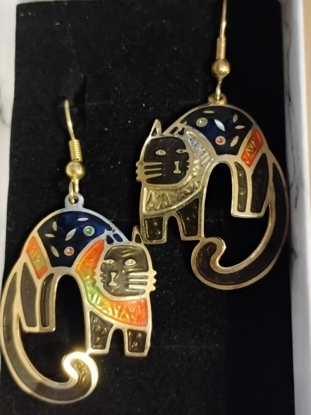 Edgar Berebi cat earrings.